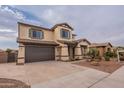 Two-story house with a brown garage door and landscaping at 1923 E Zion Way, Chandler, AZ 85249