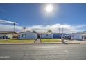 Charming single story home with a well-manicured lawn and updated landscaping at 2265 E Elmwood St, Mesa, AZ 85213