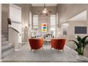 Living room with high ceilings, neutral colors, and stylish furniture at 30417 N 42Nd Pl, Cave Creek, AZ 85331