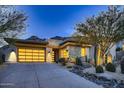 Modern home exterior with a sleek design and desert landscaping at 13454 N Stone View Trl, Fountain Hills, AZ 85268