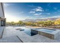 The pristine pool and patio provide a stunning view of the desert landscape and majestic mountains at 3703 S Avenida De Angeles --, Gold Canyon, AZ 85118