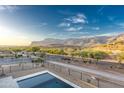 Backyard pool features a mountain view and desert landscaping, creating a serene outdoor living space at 3703 S Avenida De Angeles --, Gold Canyon, AZ 85118