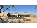 Modern home featuring a rooftop terrace, desert landscaping, and a sleek, stucco exterior at 3703 S Avenida De Angeles --, Gold Canyon, AZ 85118