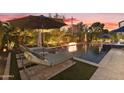 Relaxing poolside view with lounge chairs and fire pit at 6010 N 5Th Ave, Phoenix, AZ 85013