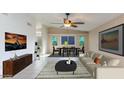 Cozy living room features tile flooring, contemporary furniture, and natural light at 6819 E Grandview Dr, Scottsdale, AZ 85254