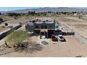 Lovely exterior view of desert home with private balconies, well maintained landscaping, and desert style yard at 7214 N 183Rd Ave, Waddell, AZ 85355