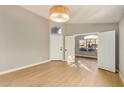 Bright and airy entryway with light wood flooring at 9829 E Onza Ave, Mesa, AZ 85212