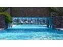Relaxing pool area with waterfall feature and lounge chairs at 1331 W Baseline Rd # 260, Mesa, AZ 85202