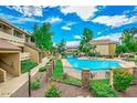 Community pool with surrounding landscaping at 1331 W Baseline Rd # 260, Mesa, AZ 85202