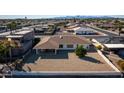 Backyard view showing a large gravel area and a small tree at 15013 N Cameo Dr, Sun City, AZ 85351