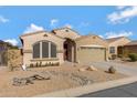 One-story house with gravel landscaping and a two-car garage at 18446 E Azul Ct, Gold Canyon, AZ 85118