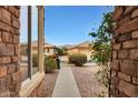 Brick walkway leading to the front door with mountain views at 22555 W Antelope Trl, Buckeye, AZ 85326