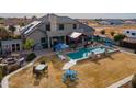 Inviting backyard oasis with a sparkling pool and patio at 3770 E Graythorn Way, Coolidge, AZ 85128