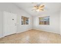 Living room with tile floors and ceiling fan at 403 W Roosevelt Ave, Coolidge, AZ 85128