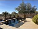 Inviting pool and spa area with ample surrounding space at 4047 E Pullman Rd, Cave Creek, AZ 85331