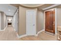 Light and airy hallway with hardwood floors at 4805 N Woodmere Fairway -- # 1003, Scottsdale, AZ 85251