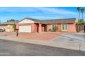 Single story home with a two-car garage and gravel driveway at 6934 W Orange Dr, Glendale, AZ 85303