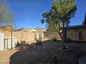 Small backyard with gravel, patio furniture, and a covered patio at 8944 E Red Mountain Ln, Gold Canyon, AZ 85118