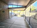 Covered patio with concrete flooring and screened sides at 8944 E Red Mountain Ln, Gold Canyon, AZ 85118