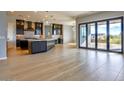 Gourmet kitchen boasts expansive island, custom cabinetry, and high-end appliances at 103 E Quartz Rock Rd, Phoenix, AZ 85085