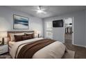 Spacious bedroom with a large bed, walk-in closet, and TV at 11048 N 28Th Dr # 247, Phoenix, AZ 85029