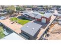 Aerial view showing house, detached garage, and large yard at 11120 E Grove St, Mesa, AZ 85208