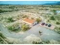 Aerial view showing home, parking area, and desert landscape at 11865 N Allegro Rd, Maricopa, AZ 85139