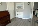Clean and bright entryway with shoe storage and wood-look flooring at 16210 N 32Nd Way, Phoenix, AZ 85032
