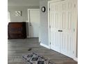 Clean and bright hallway with wood-look flooring and storage at 16210 N 32Nd Way, Phoenix, AZ 85032