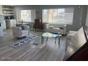 Bright and airy living room with modern furniture and large windows at 16210 N 32Nd Way, Phoenix, AZ 85032