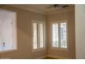 Dining room features plantation shutters and tile flooring at 3410 N 131St Ln, Litchfield Park, AZ 85340