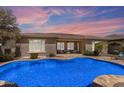 Inviting backyard oasis featuring a sparkling pool and patio area at 3957 E Beechnut Pl, Chandler, AZ 85249