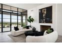 Modern living room features a large artwork and city views at 5939 E Quartz Mountain Rd, Paradise Valley, AZ 85253