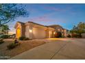 Single story home with a two car garage, and desert landscaping at 22719 N 93Rd St, Scottsdale, AZ 85255