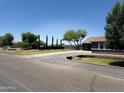 Home with a long driveway and a large green lawn at 22834 E Mccowan Ct, Queen Creek, AZ 85142