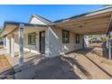 Updated home featuring a carport and porch at 3212 W Jackson St, Phoenix, AZ 85009