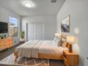 Bright bedroom with light wood furniture and double doors at 41096 W Jenna Ln, Maricopa, AZ 85138