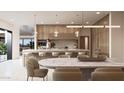 Open concept kitchen showcasing wood cabinets, an island with seating, and a dining area at 5761 N Echo Canyon Cir, Phoenix, AZ 85018