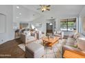 Bright living room with hardwood floors and comfy seating at 6546 E Casa De Risco Ln, Gold Canyon, AZ 85118