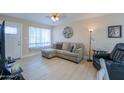 Bright living room with sectional sofa, recliner, and plenty of natural light at 8323 W Devonshire Ave, Phoenix, AZ 85037