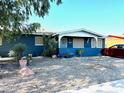 Charming ranch-style home with a well-maintained front yard at 14820 N 35Th St, Phoenix, AZ 85032