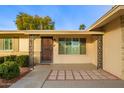 Front entrance with decorative columns and a paved walkway at 15446 N Lakeforest Dr, Sun City, AZ 85351