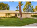 House exterior showcasing a well-maintained lawn and driveway at 15446 N Lakeforest Dr, Sun City, AZ 85351