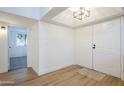 Open entryway offering views into living area and bedroom at 18811 N 19Th Ave # 3018, Phoenix, AZ 85027