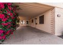 Covered carport showcasing the home's entrance and desert landscaping at 2233 N Middlecoff Dr, Mesa, AZ 85215
