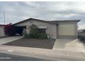 Single-story brick home with covered carport and mature landscaping at 2233 N Middlecoff Dr, Mesa, AZ 85215