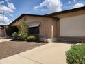 Property featuring low-maintenance landscaping, brick accents, and a well-maintained exterior at 2233 N Middlecoff Dr, Mesa, AZ 85215