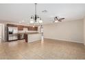 Spacious kitchen boasting stainless steel appliances, granite countertops and center island at 2233 N Middlecoff Dr, Mesa, AZ 85215