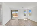 Light and airy living area with sliding glass doors leading to a patio at 31277 N 130Th Ave, Peoria, AZ 85383