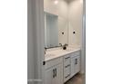 Modern bathroom with double sink vanity, quartz countertops, and dark hardware at 31363 N 130Th Ave, Peoria, AZ 85383